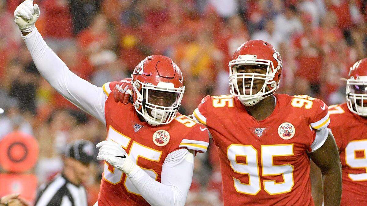 Kansas City Chiefs defensive end Frank Clark (55) celebrates with defensive end Chris Jones (95) after a sack during the game against the San Francisco 49ers at Arrowhead Stadium.