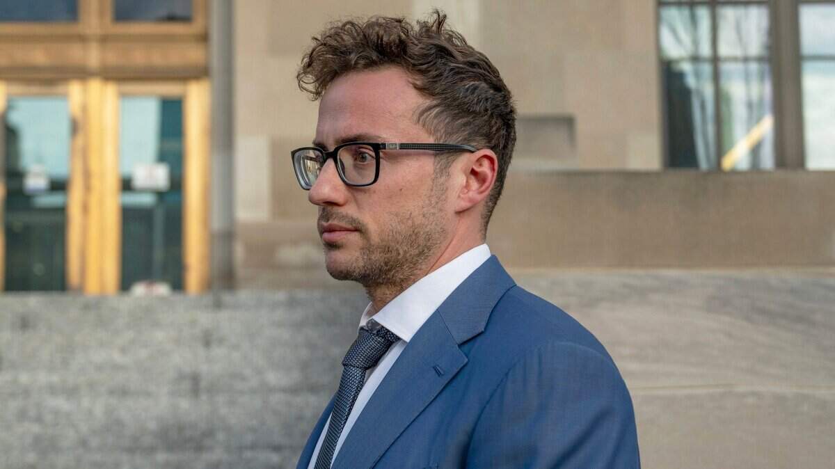 Kansas City manager Brian Platt is seen on the steps of the Kansas City Police Department headquarters during a 2024 press conference.