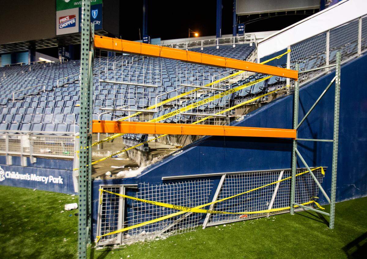Part of the railing going up from the visitor’s tunnel at Children’s Mercy Park rests on the ground broken after it failed following the Sporting Kansas City match Thursday night against Toluca in the Round of 16 of the CONCACAF Champions League. Multiple fans fell from the stands and at least one Toluca supporter received medical attention on the field.