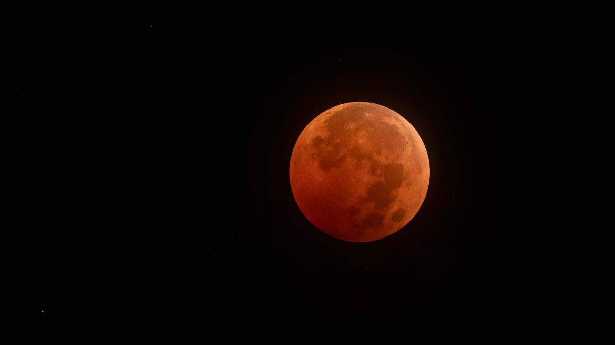 Former Kansas City Star photographer John Sleezer captured the total eclipse of the moon in the early morning hours of Tuesday, November 8, 2022 in Olathe, Kan. The next total lunar eclipse won’t be visible in this area until March 2025.