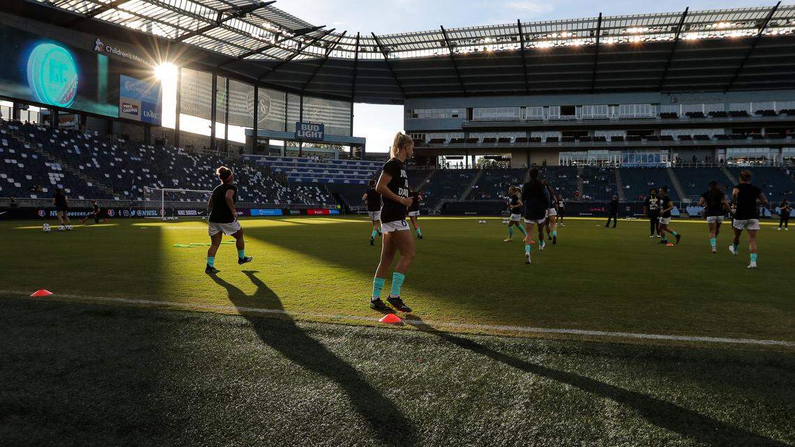 Members of the KC NWSL team warm up before this season’s home-opening match against the Houston Dash at Children’s Mercy Park in Kansas City, Kan.