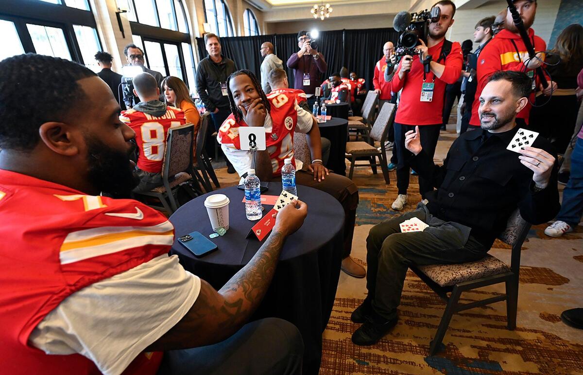Kansas City Chiefs offensive tackle Donovan Smith, left, and Wanya Morris, offensive line, participated in a magic trick with Steven Frayne, better known by his former stage name Dynamo, during media availability at the team hotel in Henderson, Nev., on Thursday, Feb. 8, 2024. Frame is from the U.K.