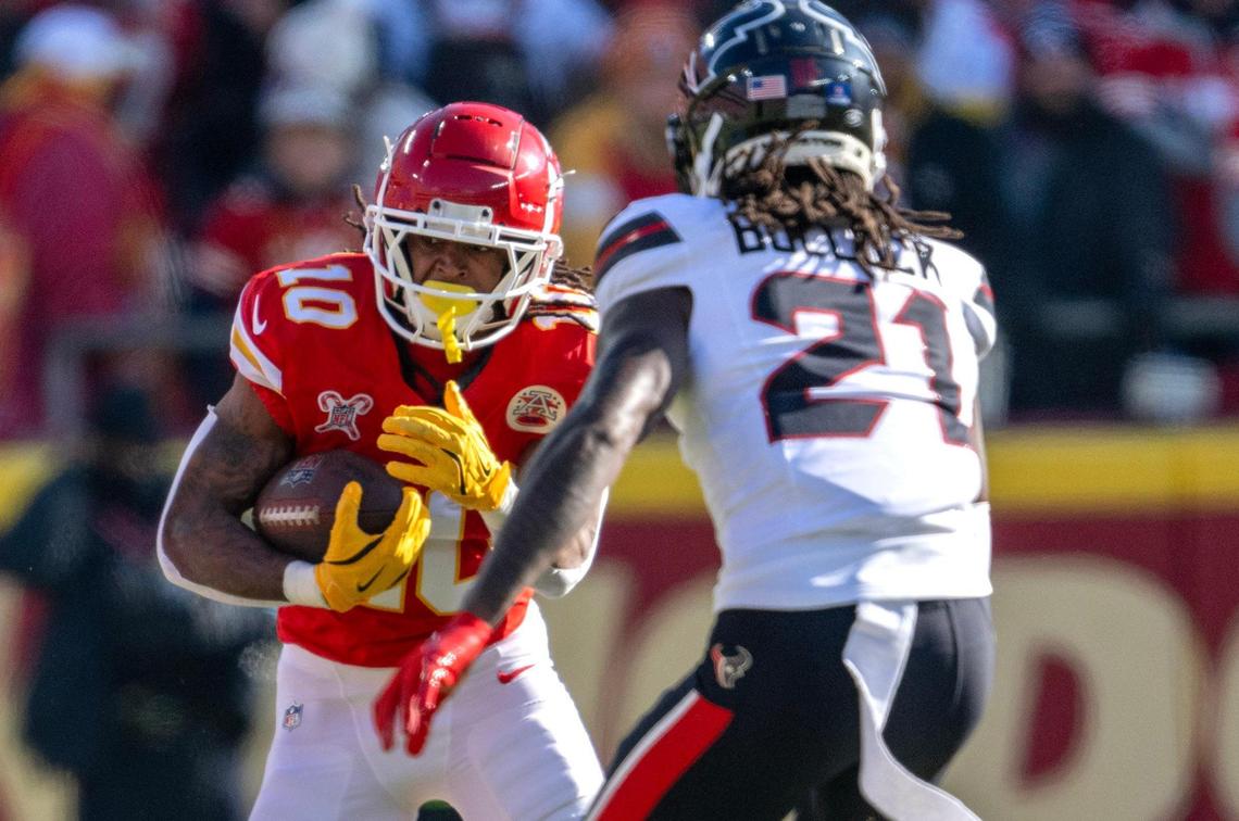 Kansas City Chiefs running back Isiah Pacheco (10) runs up against Houston Texans safety Calen Bullock (21) in the first half against at GEHA Field at Arrowhead Stadium on Saturday, Dec. 21, 2024.