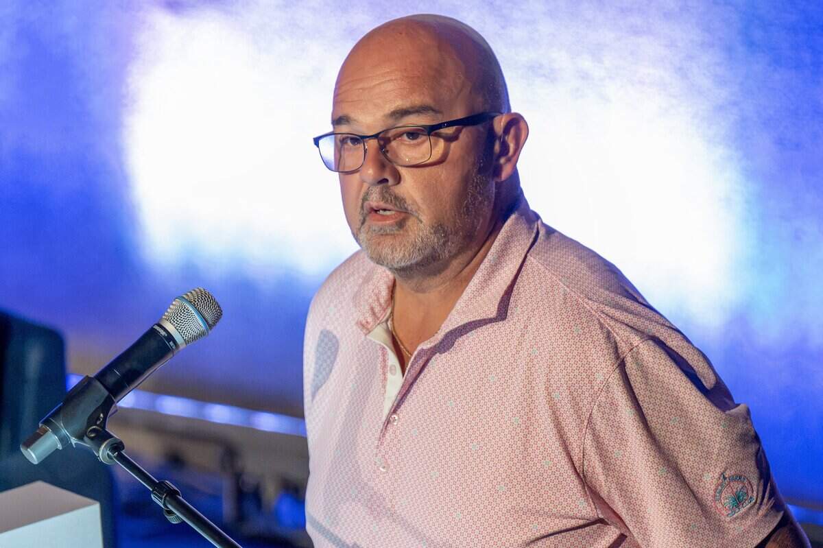 Ralph Oropeza, business manager of the Greater Kansas City Building and Construction Trades Council, speaks during a presentation about the proposed rezoning of Crown Center for a new Kansas City Royals ballpark at the Regnier Theatre inside Union Station on Monday, July 27, 2026, in Kansas City.