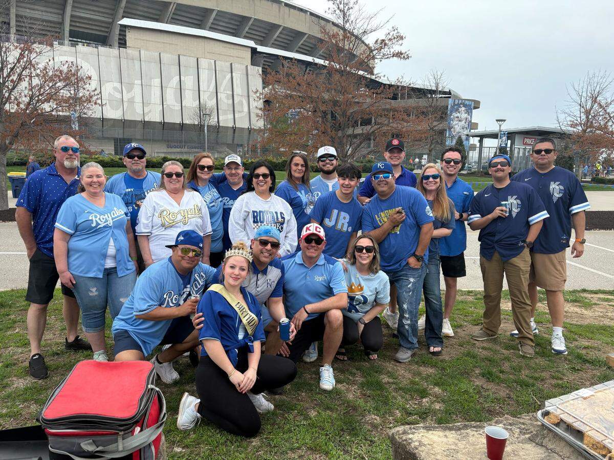 Brandon Schwarz (center middle, wearing white hat) went to the Royals’ opening day game with a group of friends. He used one of his sick days to attend.