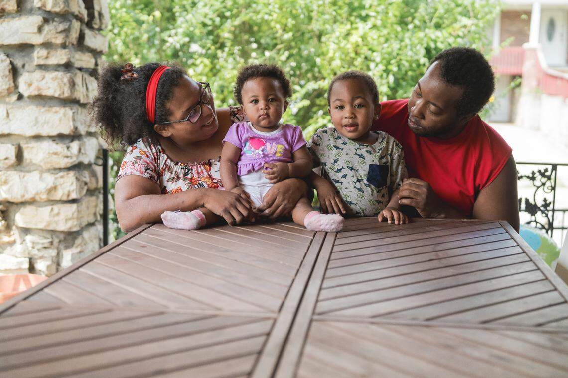 Kaamilya Hobbs, a 33-year-old worker at Arby’s in Kansas City, is pictured with her two of her kids and her boyfriend Allen Strickland. Hobbs received a pay raise after voters approved Proposition A.