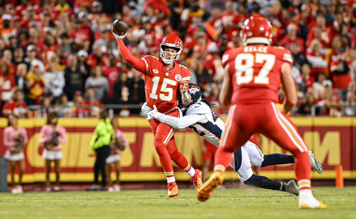 Chiefs quarterback Patrick Mahomes finds tight end Travis Kelce for a completion against the Denver Broncos on Thursday night at GEHA Field at Arrowhead Stadium.