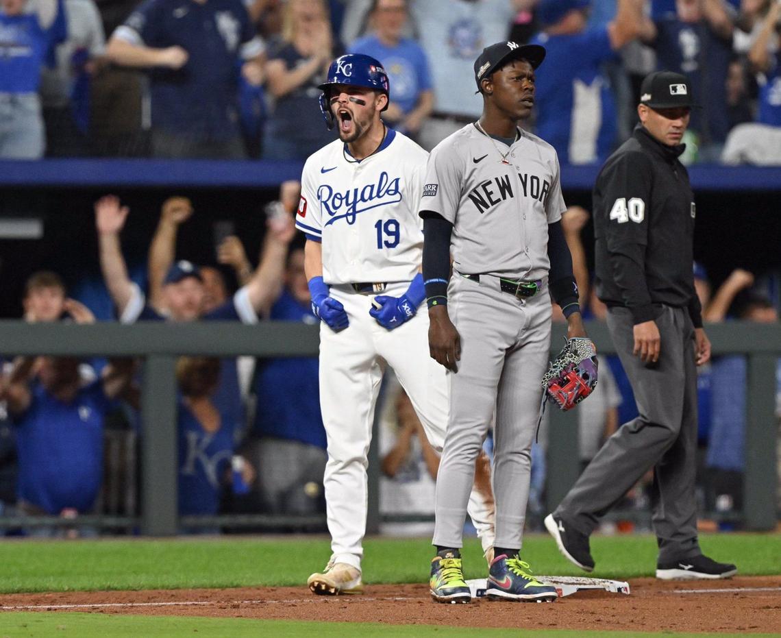 New York Yankees third baseman Jazz Chisholm Jr. (13) looks on while Kansas City Royals second baseman Michael Massey (19) celebrates a triple to drive in outfielder Kyle Isbel (28) in the fifth inning during Game 3 of the American League Division Series on Wednesday, Oct. 9, 2024, at Kauffman Stadium.