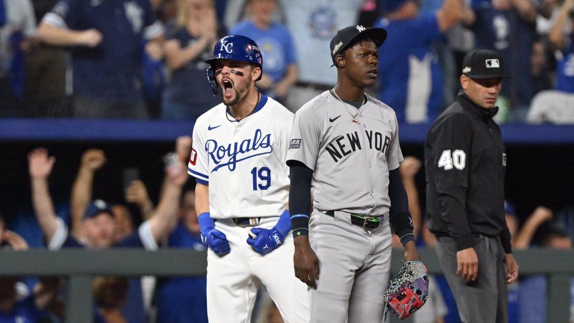 New York Yankees third baseman Jazz Chisholm Jr. (13) looks on while Kansas City Royals second baseman Michael Massey (19) celebrates a triple to drive in outfielder Kyle Isbel (28) in the fifth inning during Game 3 of the American League Division Series on Wednesday, Oct. 9, 2024, at Kauffman Stadium.
