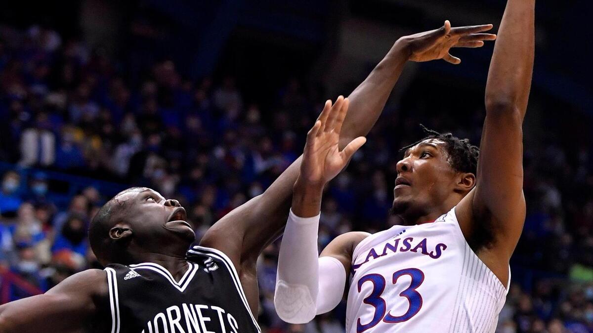 KU’s David McCormack shoots over ESU’s Mayuom Buom during the first half of Tuesday night’s exhibition game at Allen Fieldhouse in Lawrence.