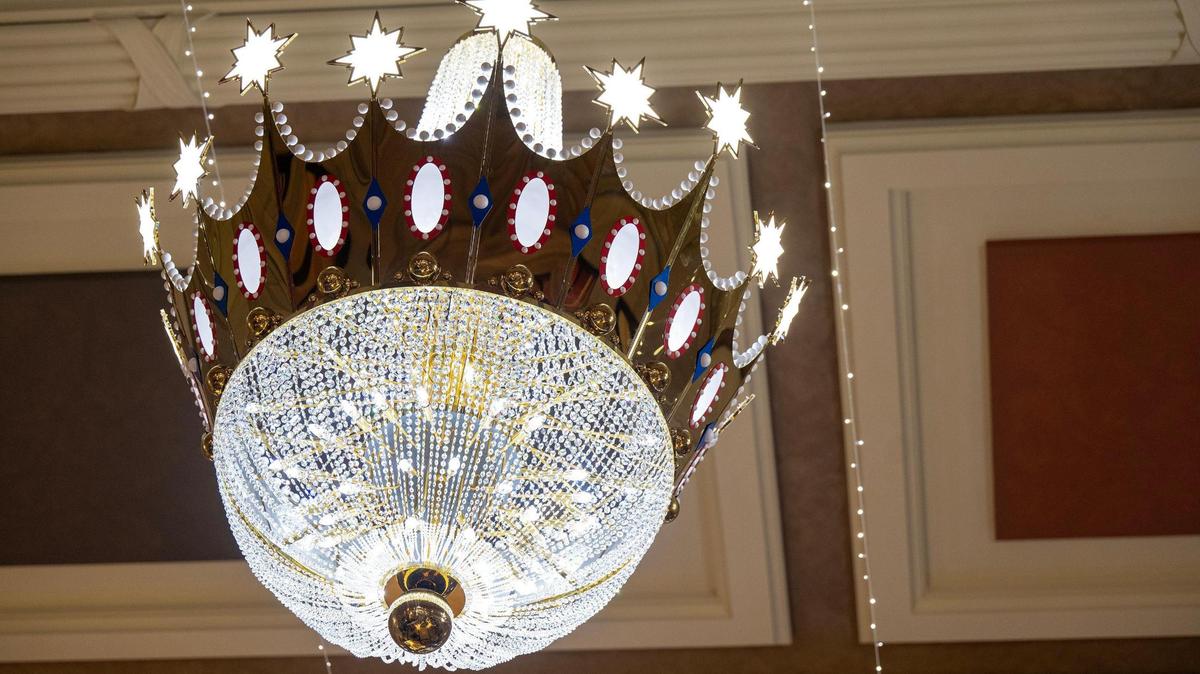 A highlight of the new “Holiday Reflections” event at Union Station this year are two massive, crown-shaped chandeliers that pay homage to crowns that used to decorate downtown Kansas City for the holidays.