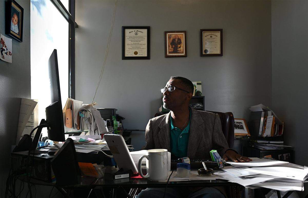 Funeral director Malcolm Morris works on correspondence and other business items before the doors open for the day on Wednesday, Sept. 8, 2021 at Elite Funeral Chapel, 11525 Blue Ridge Blvd, in Kansas City. Morris has decided to stop providing funeral services for homicide victims.