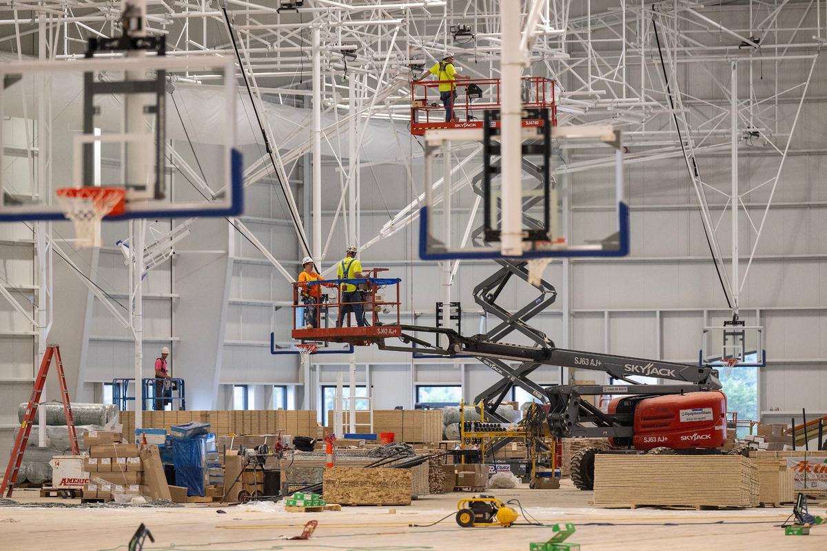 Workers make progress at the AdventHealth Sports Park at Bluhawk in Overland Park in July. It’s set to open in October.