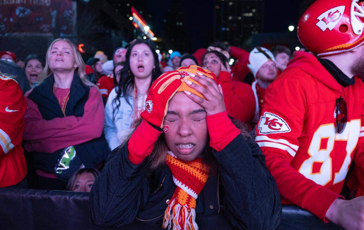 Porschae Oglesby of Topeka reacts after a Kansas City fumble during the first half while watching the game from the Power and Light District in downtown Kansas City.