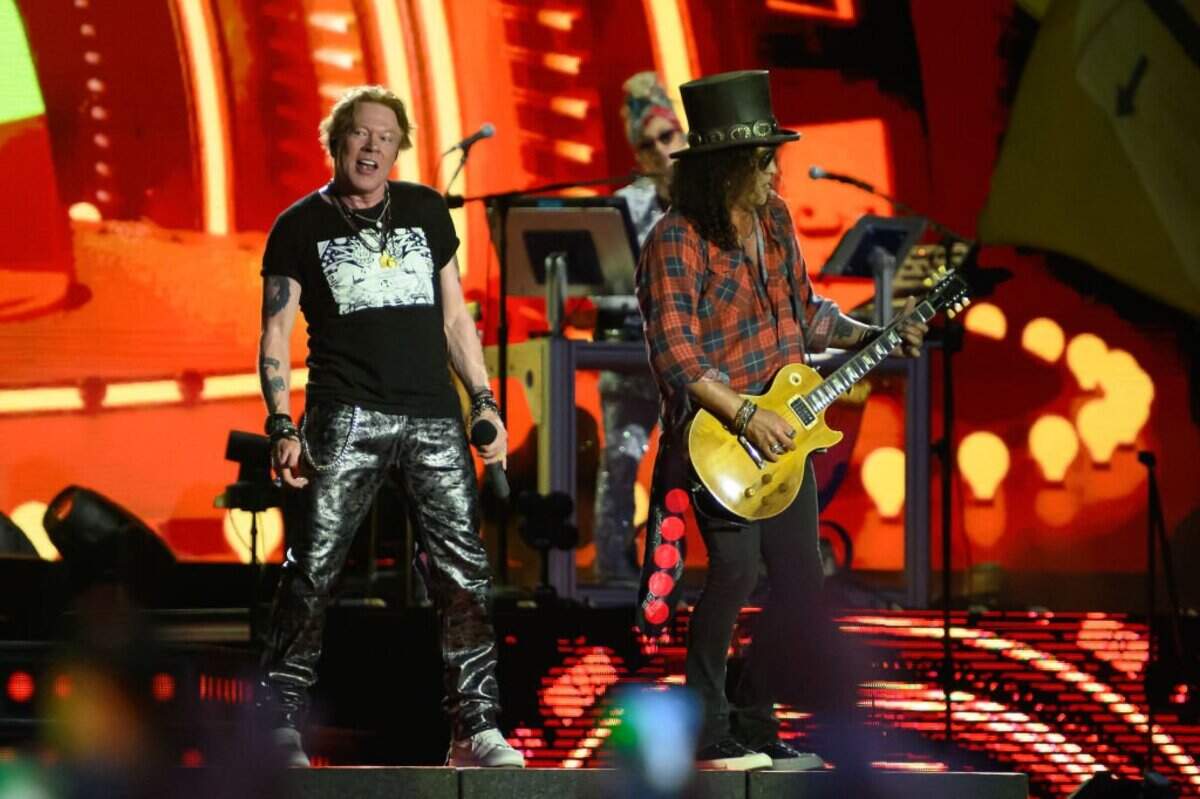 GLASTONBURY, ENGLAND - JUNE 24: Axl Rose (L) and Slash of Guns 'n' Roses perform on the Pyramid Stage on Day 4 of Glastonbury Festival 2023 on June 24, 2023 in Glastonbury, England. The Glastonbury Festival of Performing Arts sees musicians, performers and artists come together for three days of live entertainment. (Photo by Leon Neal/Getty Images)