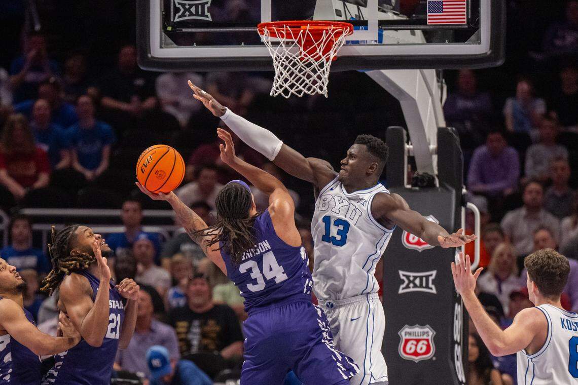 BYU Cougars center Keba Keita (13) contests a shot by Kansas State Wildcats guard Nate Johnson (34) in the second half of the Wildcats first round game vs. the BYU Cougars in the Big 12 Men's Basketball Tournament, on Tuesday, March 10, 2026, at T-Mobile Center. The Wildcats lost to BYU, 105-91.