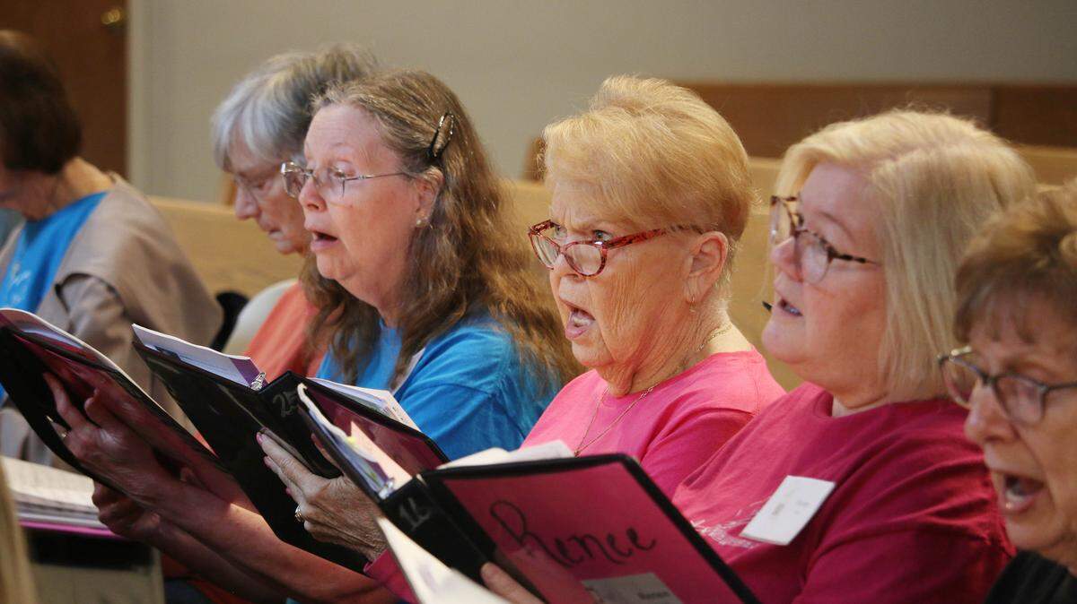 Kathleen Simon, Judith Brown and Renee Crippin sing during an EncoreKC! rehearsal at Grace Covenant Presbyterian Church in Overland Park.