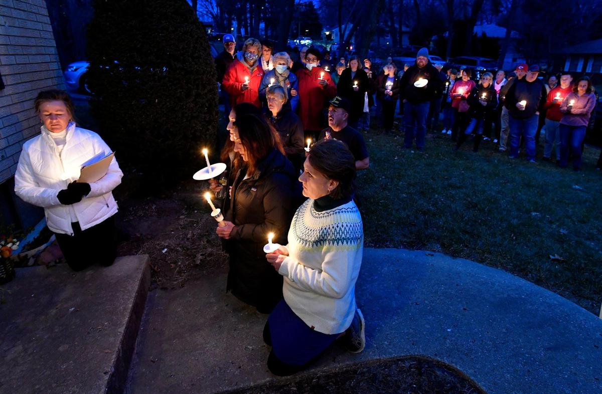 A candle light vigil was held Monday evening at the Kansas City, Kan. home of Patricia Panijan, who was killed on Christmas Eve when someone opened fire outside the house, striking the home several times. Panijan was declared dead at the scene, and her husband, who was also hit, survived and has been released from the hospital. Three of the Panijan’s daughters, Gina, Joanna and Mary, knelt in prayer during the vigil.