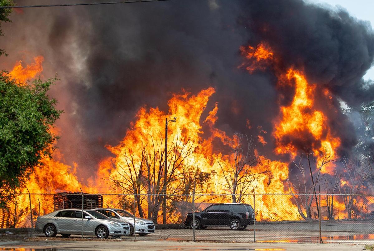 Flames engulf stacks of pallets at Pioneer Pallet in the 3500 block of Nicholson Ave. on Thursday, June 15, 2023, in Kansas City.