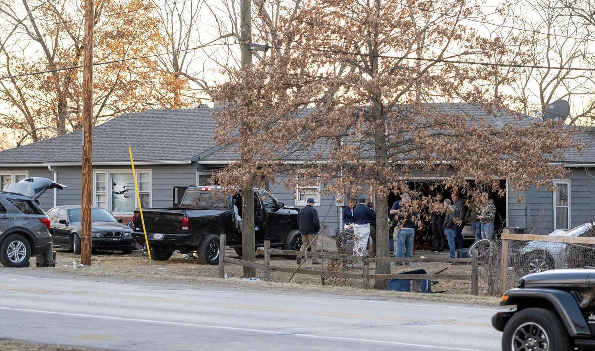 Law enforcement officials investigate the scene where three KCPD officers were shot and injured during a standoff in the 2300 block of Blue Ridge Boulevard on Wednesday, March 1, 2023, in Kansas City.