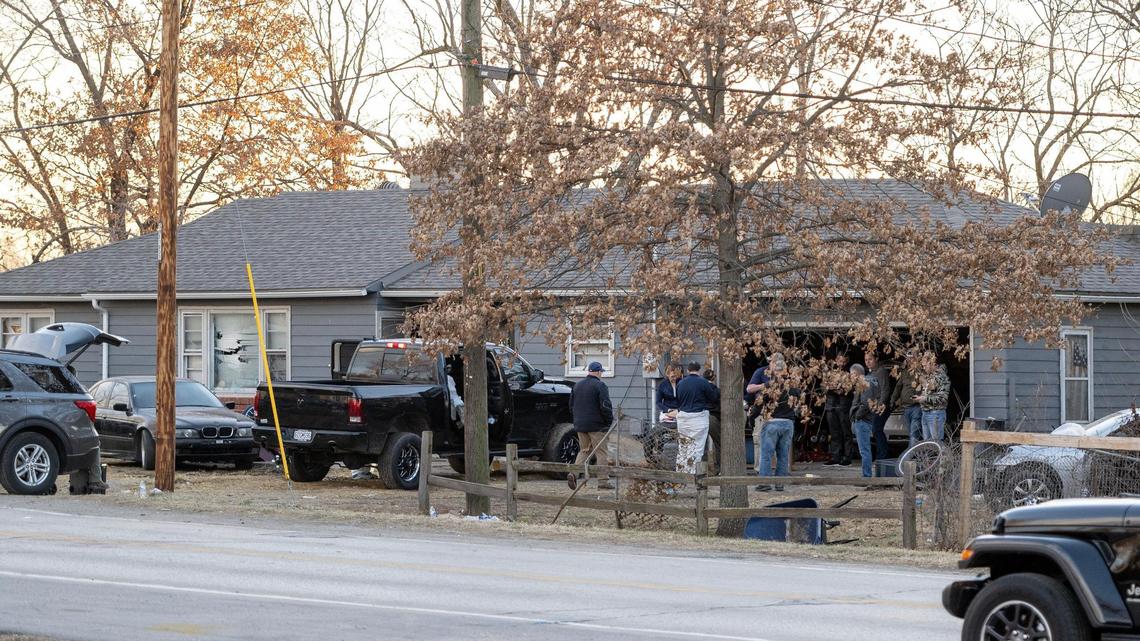 Law enforcement officials investigate the scene where three Kansas City police officers were shot and injured during a standoff in the 2300 block of Blue Ridge Boulevard on Wednesday. 
