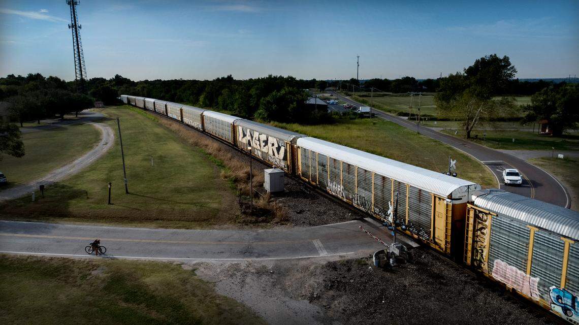 A BNSF train rolls through the Maple Street crossing in Noble, Oklahoma. In 2020, Noble resident Gene Byrd had suffered a heart attack when first responders had to wait at the crossing due to a train that was stopped there.