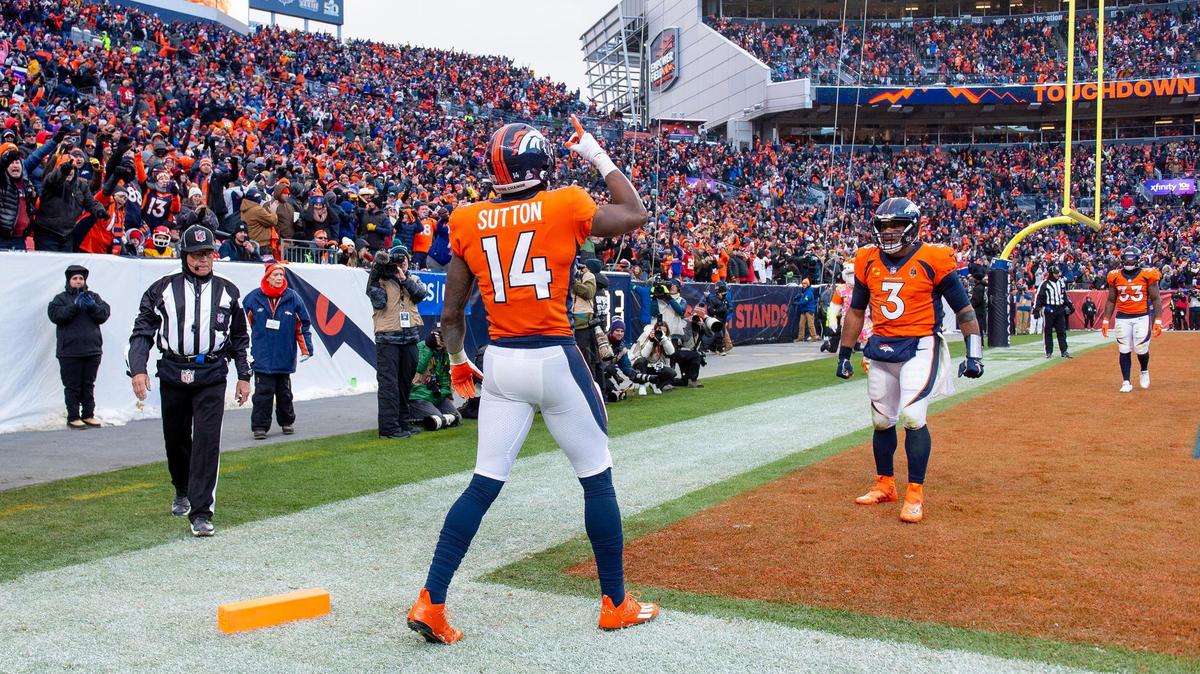 Denver Broncos wide receiver Courtland Sutton (14) celebrates a touchdown reception with quarterback Russell Wilson (3) during an NFL football game against the Kansas City Chiefs at Empower Field at Mile High on Sunday, Oct. 29, 2023, in Denver.