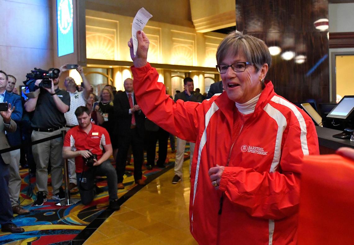 Kansas Gov. Laura Kelly places the first legal sports bet in Kansas in 2022.