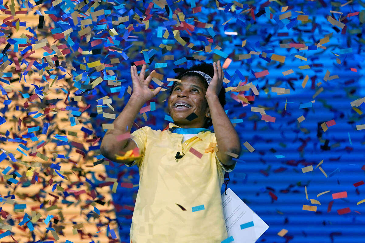 Zaila Avant-garde, 14, from Harvey, Louisiana is covered with confetti as she celebrates winning the finals of the 2021 Scripps National Spelling Bee at Disney World Thursday, July 8, 2021, in Lake Buena Vista, Fla. (AP Photo/John Raoux)