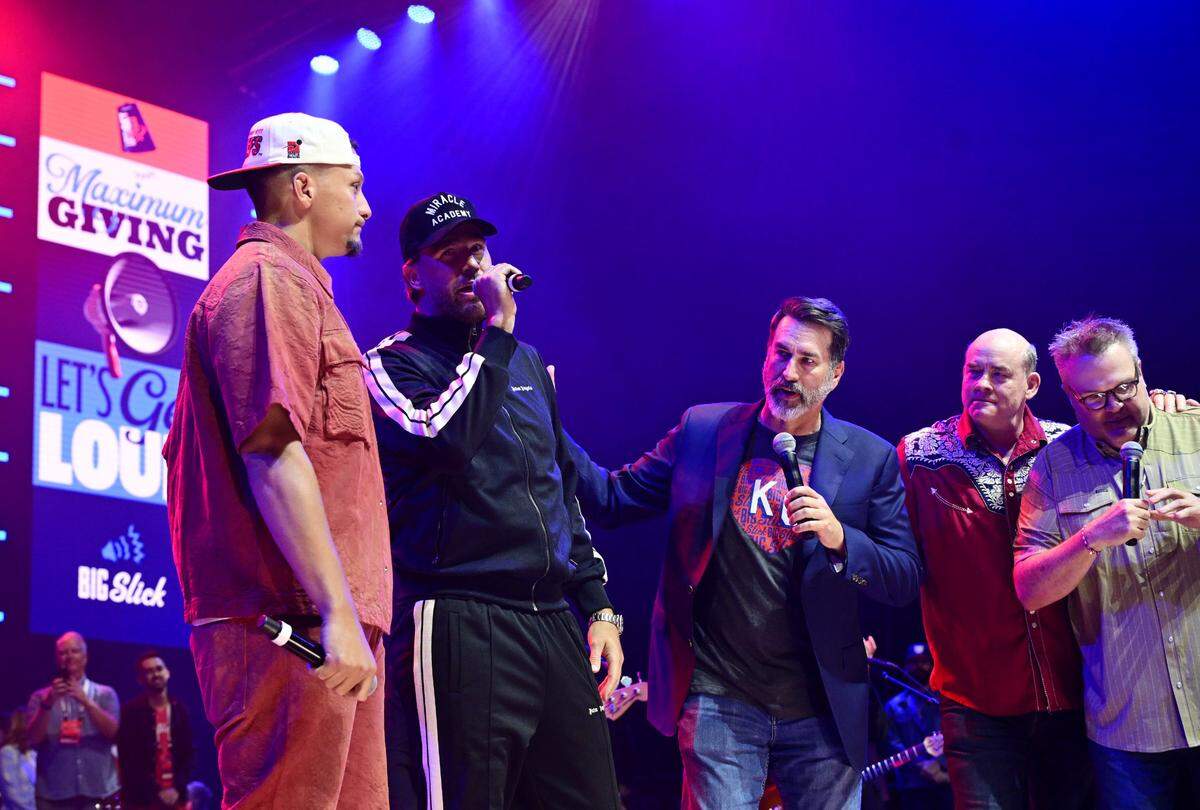 Kansas City Chiefs quarterback Patrick Mahomes, left, and Chiefs tight end Travis Kelce appeared on stage with co-hosts Rob Riggle, David Koechner and Eric Stonestreet Saturday, May 31, 2025, during the Big Slick Party and Show at T-Mobile Center in Kansas City.
