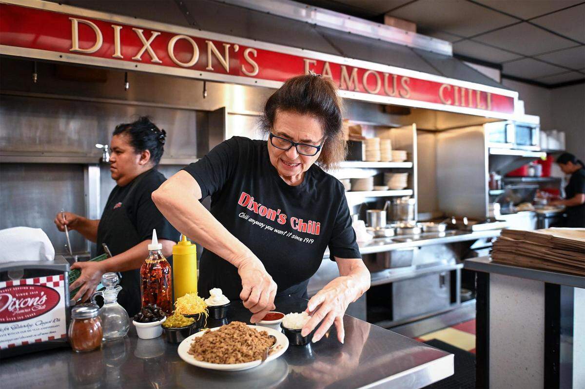 Manager Francine Graham bags up a to-go order at Dixon’s Famous Chili, 9105 E. U.S. 40, in Independence. The restaurant, which was a favorite of President Harry S. Truman, has been serving up chili since 1919. Graham has been working at Dixon’s for 36 years.