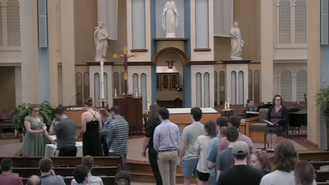 Students light candles in memory of Ian Brunner.