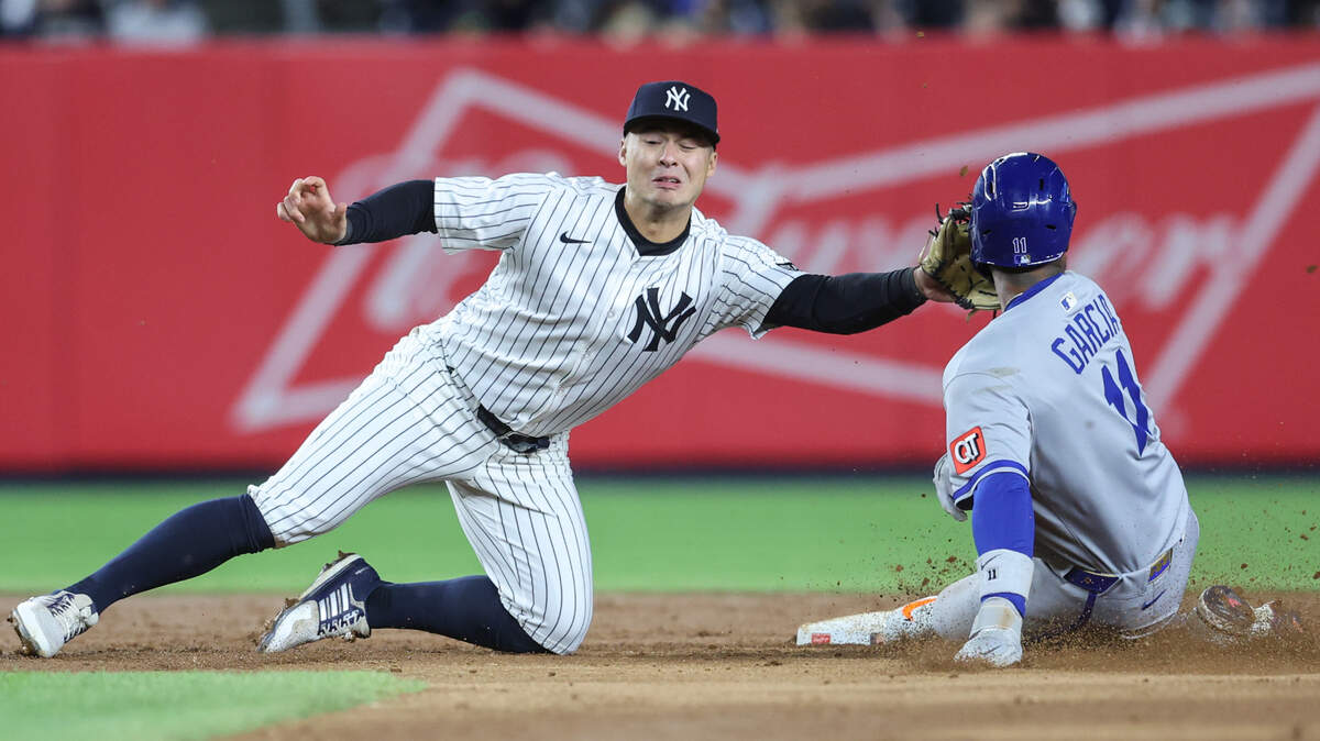 New York Yankees shortstop Anthony Volpe tags out Kansas City Royals DH and would-be base stealer Maikel Garcia, in the face, during a Wednesday, April 16, 2025 Major League Baseball game at Yankee Stadium in New York.