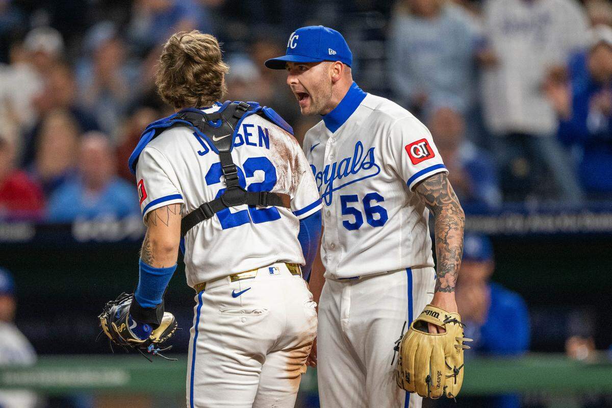 Kansas City Royals pitcher Alex Lange celebrates with teammate and catcher Carter Jensen (22) after the latter tagged out Boston Red Sox left fielder Jarren Duran on Wednesday, May 20, 2026, at Kauffman Stadium.