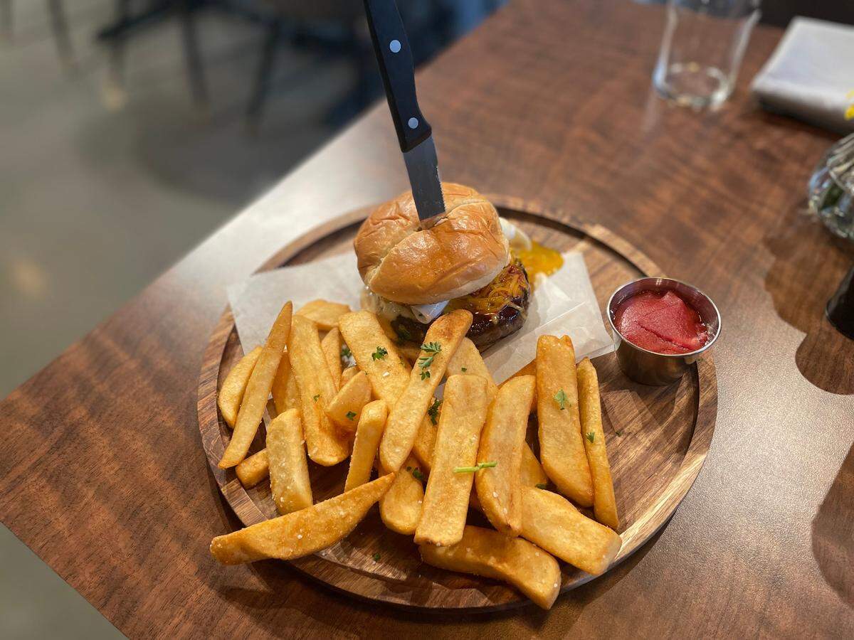 The Urban Cheddar Burger (Barham Family Farms ground chuck, cheddar, burger sauce, pickle, brioche) with an egg added.