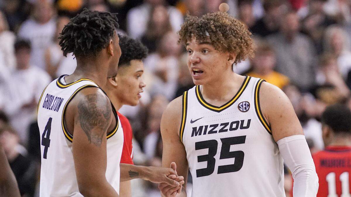 Missouri Tigers forward Noah Carter (35) celebrates with guard DeAndre Gholston (4) against the Mississippi Rebels during the second half at Mizzou Arena on March 4, 2023.