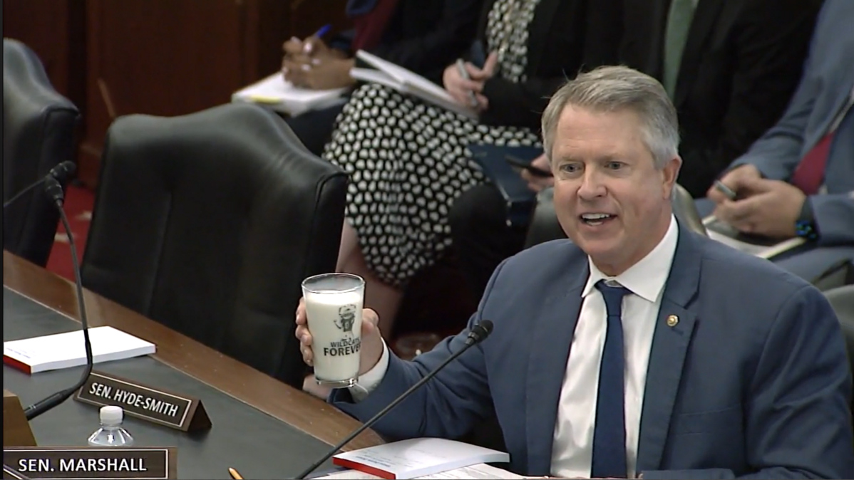 Sen. Roger Marshall holds up a glass of milk during a meeting of the U.S. Senate Committee on Agriculture, Nutrition and Forestry in Washington, D.C. on Thursday, Februrary 16, 2023.