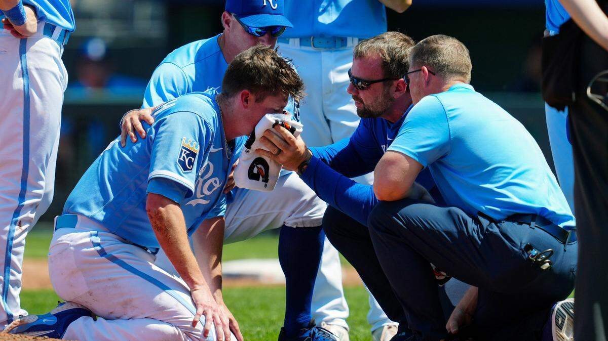 Kansas City Royals pitcher Ryan Yarbrough (48) is attended to by medical staff after being hit by a line drive during the sixth inning against the Oakland Athletics at Kauffman Stadium on May 7, 2023.