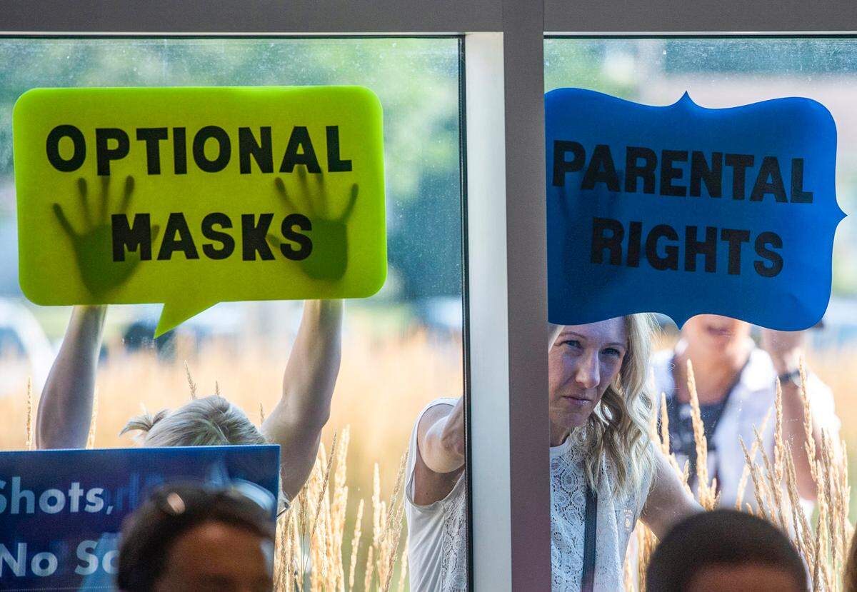 Parents protested mask mandates outside a recent Shawnee Mission school board meeting. The district, like most in the Kansas City area, now requires masks for all staff and students, pre-kindergarten through 12th grade.