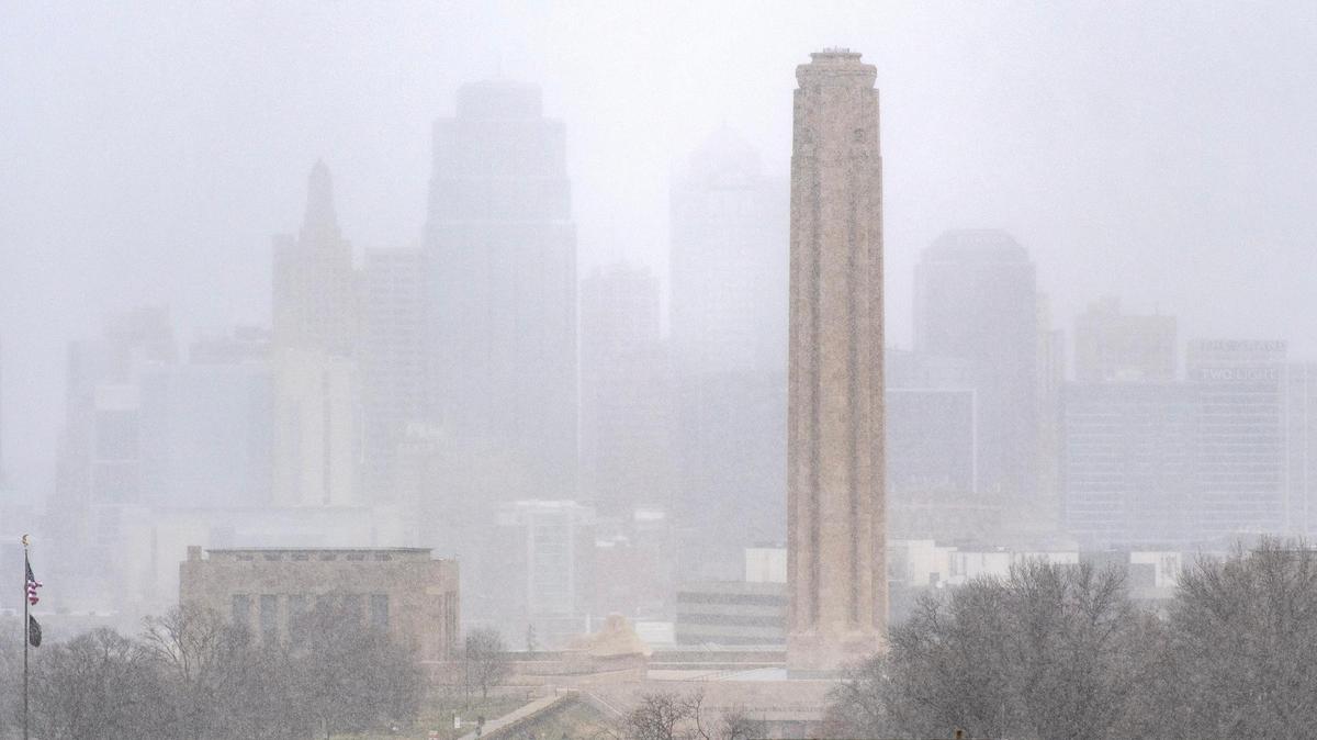 Snow showers blanket downtown Kansas City on Tuesday, Dec. 26, 2023.