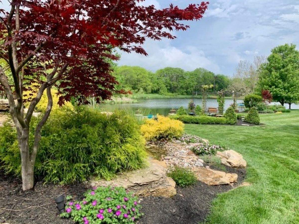 A pond invites those on the tour to pause and absorb the beauty of nature.