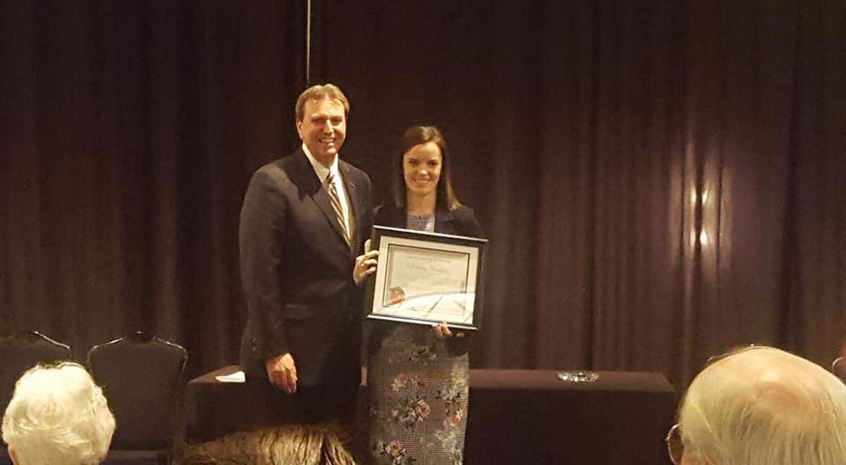 Wyandotte High School teacher Whitney Morgan, the 2019 Kansas Teacher of the Year, poses with Kansas Commissioner of Education Randy Watson.