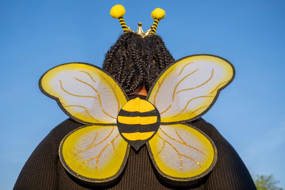 Fourteen-year-old Jaymie Moore shows off her bee wings while waiting in line to attend the last stop of Beyoncé’s Renaissance World Tour at GEHA Field at Arrowhead Stadium on Sunday, Oct. 1, 2023, in Kansas City.
