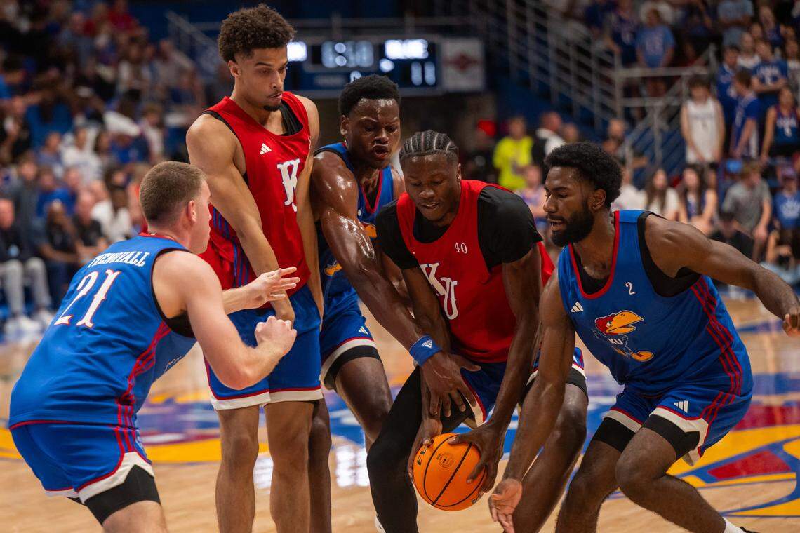 Kansas Jayhawks forward Flory Bidunga dribbles the ball into traffic during the men's scrimmage at Late Night in the Phog, on Friday, October 17, 2025, in Lawrence.