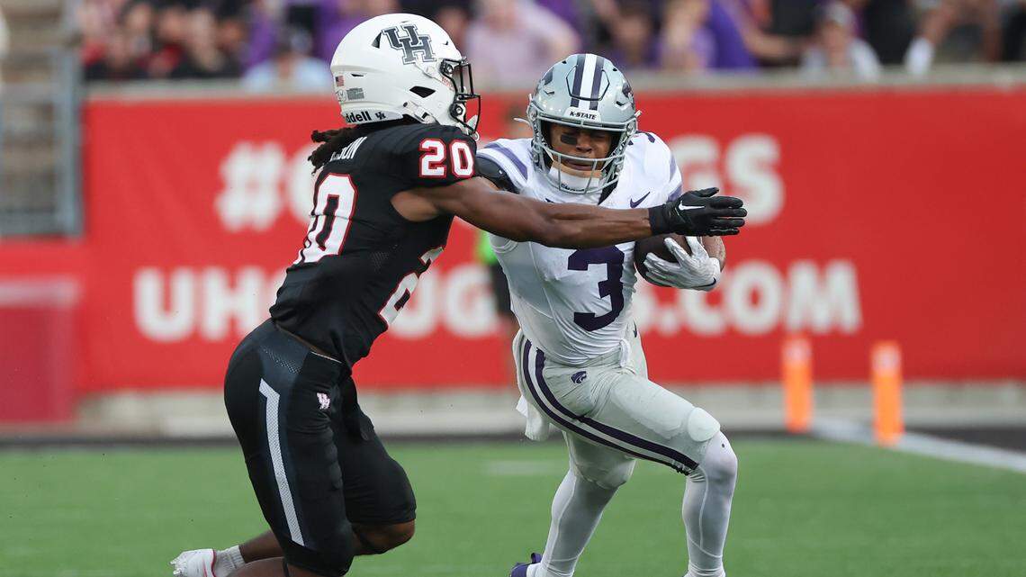 Kansas State Wildcats running back Dylan Edwards (3) is tackled by Houston Cougars defensive back Jeremiah Wilson (20) in the first quarter at TDECU Stadium on Nov. 2, 2024.