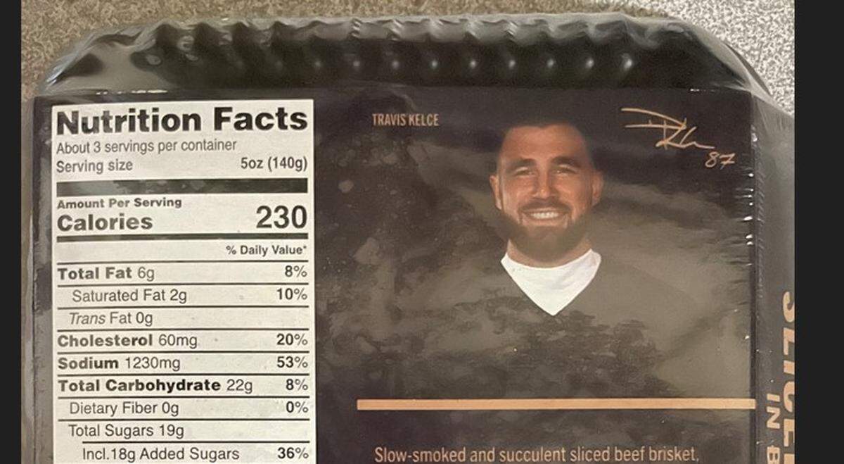 The back of the packaging includes a photo of Travis Kelce.
