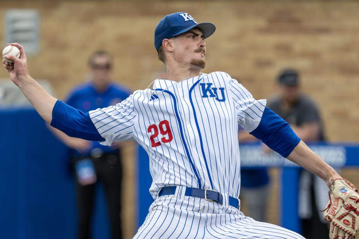 Kansas Jayhawks pitcher Boede Rahe (29) throws in the ninth inning against the Northeastern Huskies during an NCAA baseball tournament game at Hoglund Ballpark on Friday, May 29, 2026, in Lawrence.