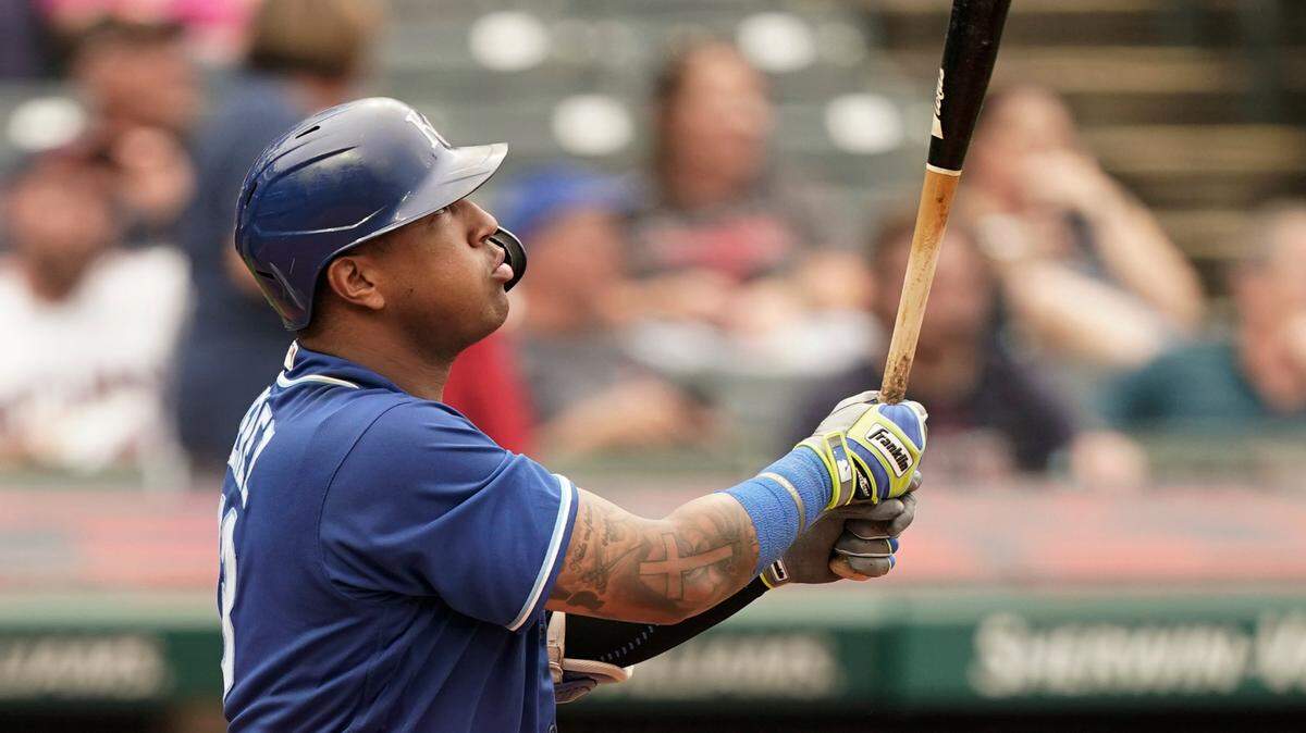 Kansas City Royals’ Salvador Perez watches his two-run home run in the fifth inning in the first baseball game of a doubleheader against the Cleveland Indians, Monday, Sept. 20, 2021, in Cleveland. The home run broke Johnny Bench’s record for the most home runs in a season by a primary catcher. (AP Photo/Tony Dejak)