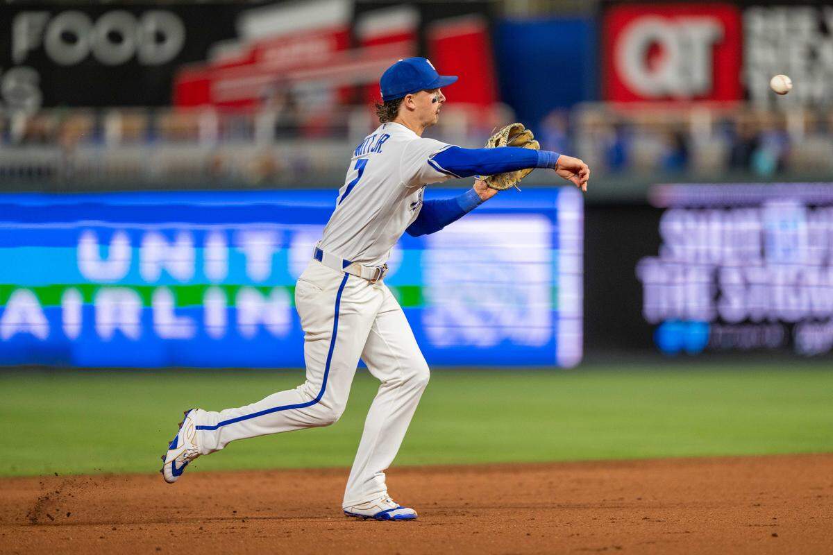 Kansas City Royals shortstop Bobby Witt Jr. (7) throws a Boston Red Sox runner out at first base on Wednesday, May 20, 2026, at Kauffman Stadium.