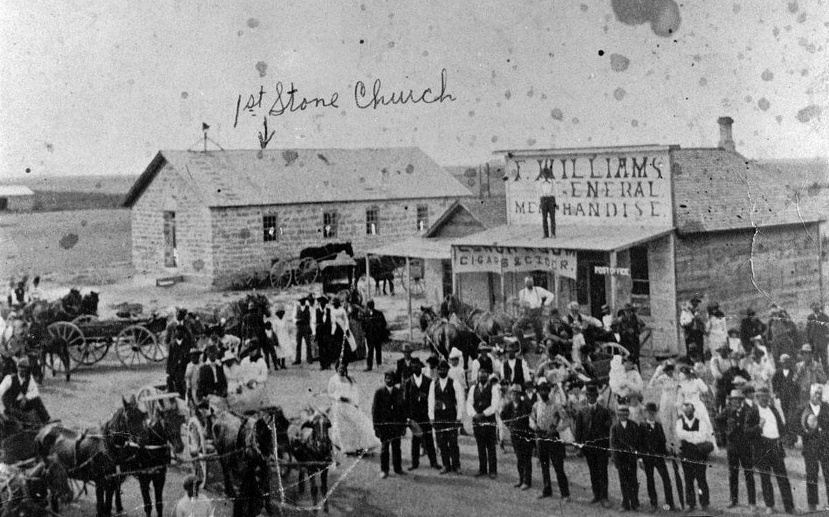 This undated photos shows residents and early structures in Nicodemus, Kansas.